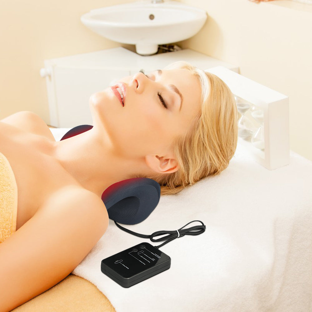 A woman lying on the red light therapy neck stretcher with warm heating therapy